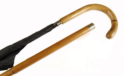 Appraisal: An umbrella cane with 'bamboo' handle and concertina outer casing