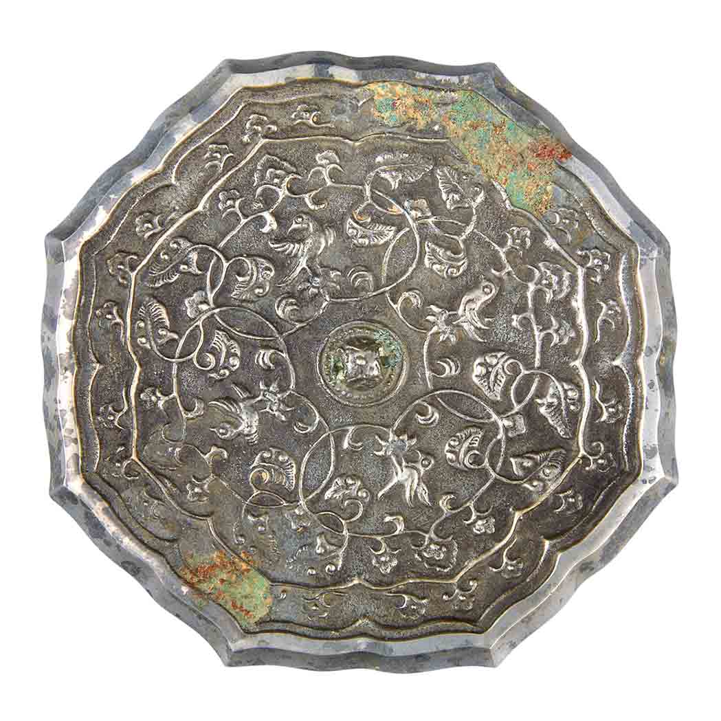 Appraisal: Chinese Silvered Bronze Mirror Tang Dynasty Of floriform cast in