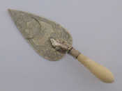 Appraisal: A Victorian ivory handled engraved silver presentation trowel by George