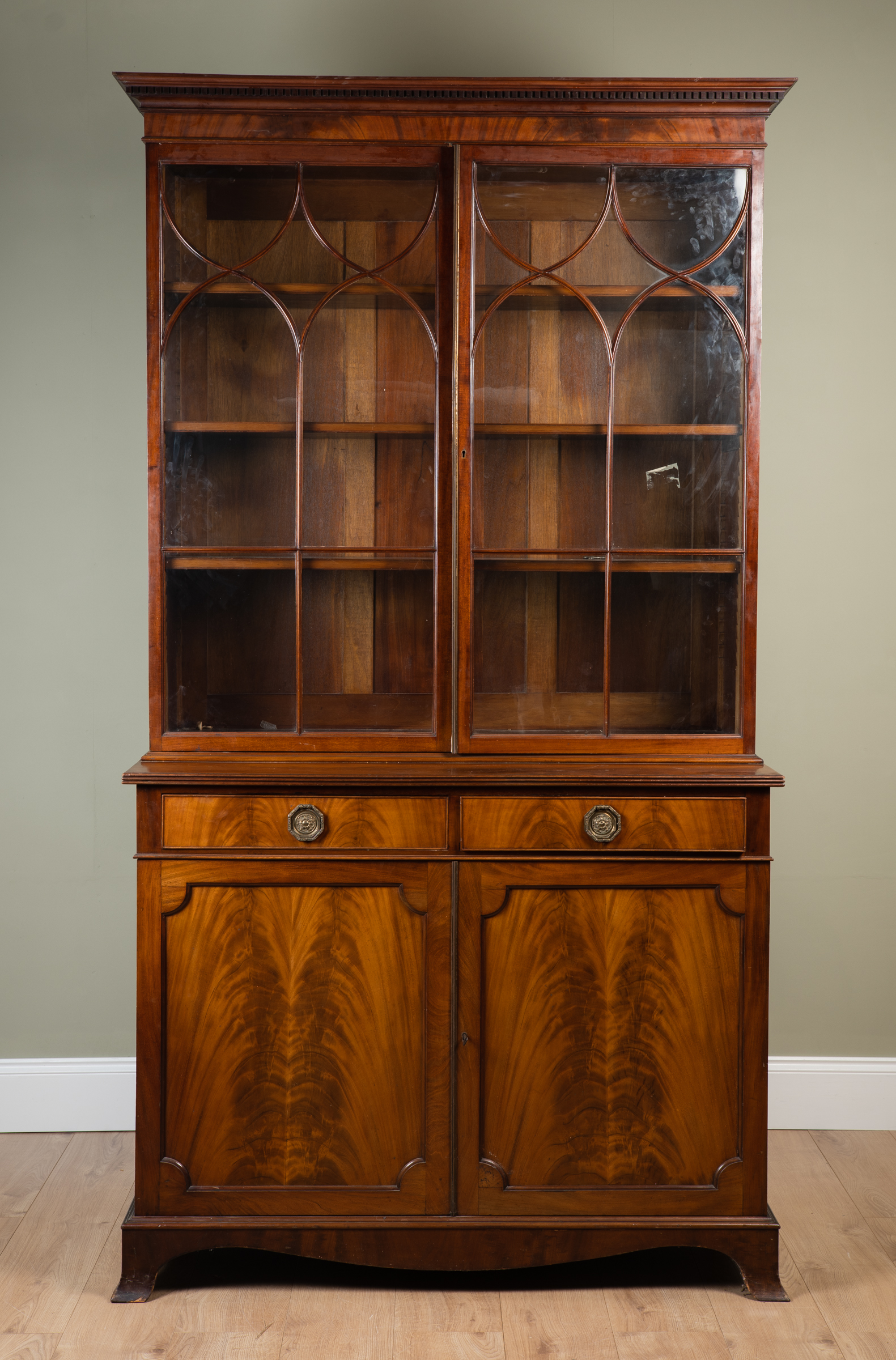 Appraisal: An early th century Georgian-style mahogany library bookcase astragal glazed