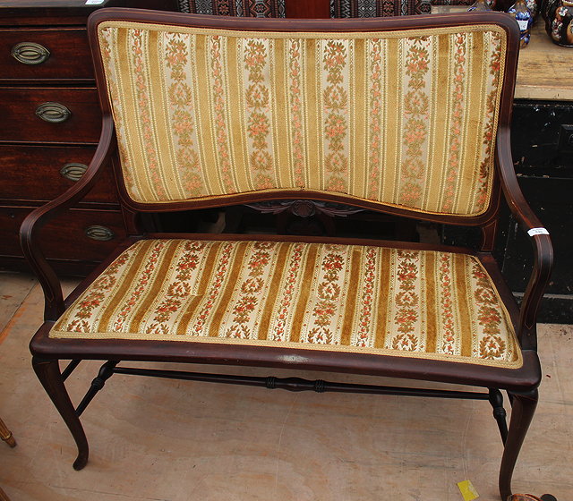 Appraisal: AN EDWARDIAN MAHOGANY AND SATINWOOD INLAID TWO SEATER SETTEE with