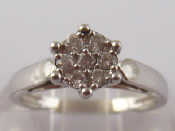 Appraisal: A white metal tests carat gold diamond cluster ring size