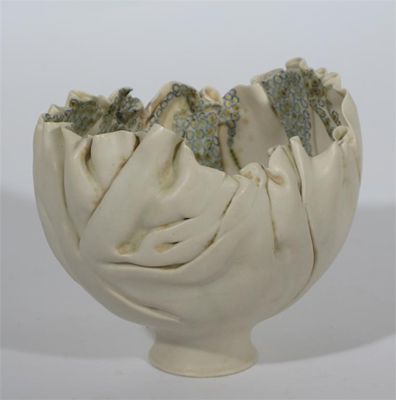 Appraisal: A porcelain sculptural vessel by Mary Rogers folded spherical form