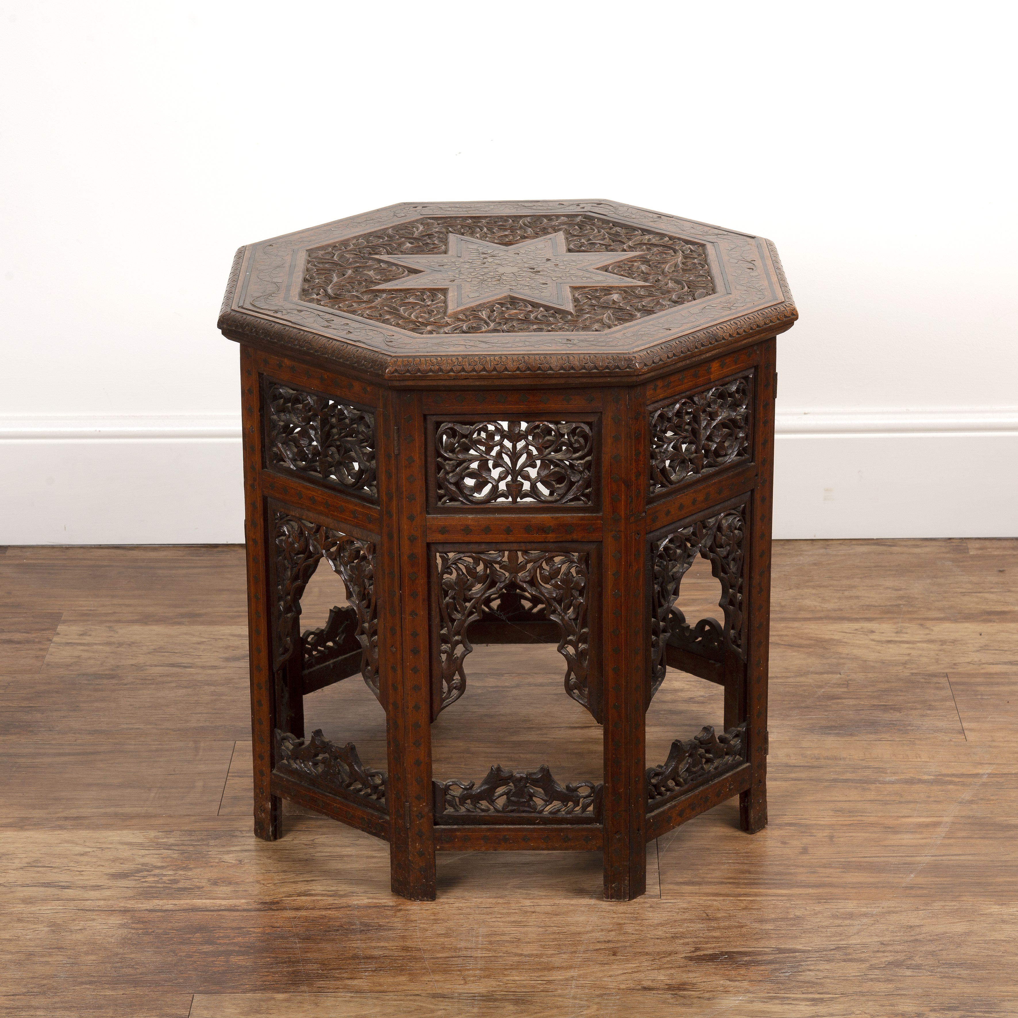 Appraisal: Octagonal occasional table Indian circa with octagonal top with brass