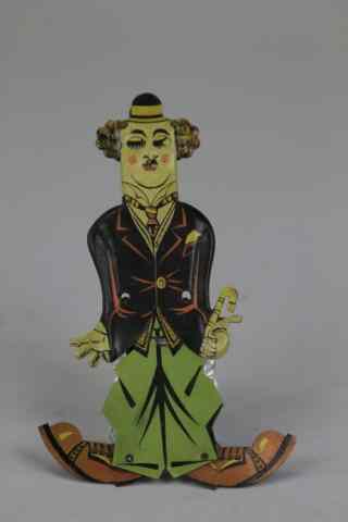 Appraisal: CHARLIE CHAPLIN SQUEEZE TOY Lithographed tin hand held toy allows