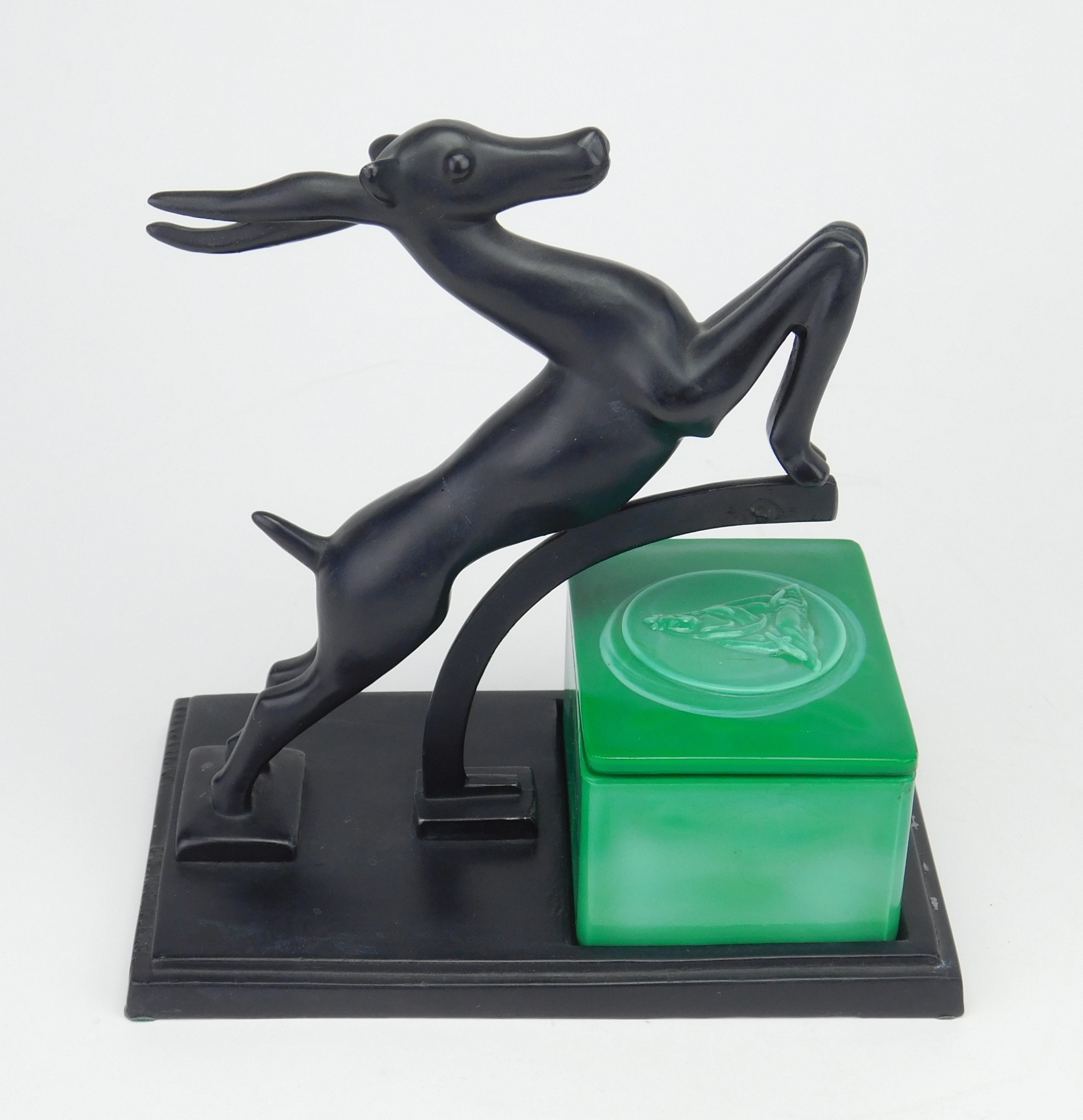 Appraisal: Frankart cigarette holder of a leaping gazelle over a green