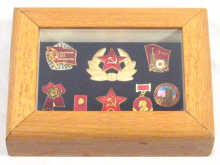 Appraisal: Russian Interest A display case containing eight Soviet badges