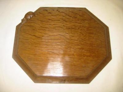 Appraisal: AN ADZED OAK BREAD BOARD by Robert Mouseman Thompson of