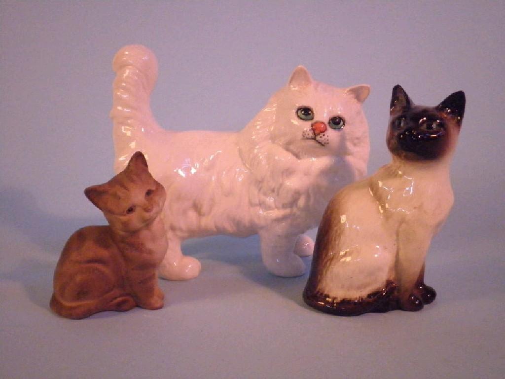 Appraisal: Beswick A Persian cat white large eyes and a Siamese