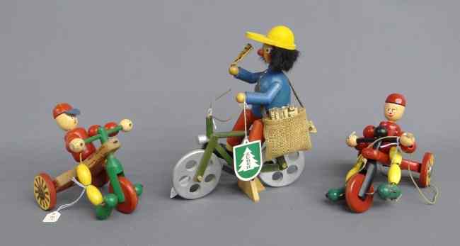 Appraisal: Lot Swedish polychrome painted wooden bicycle toys Shows typical use