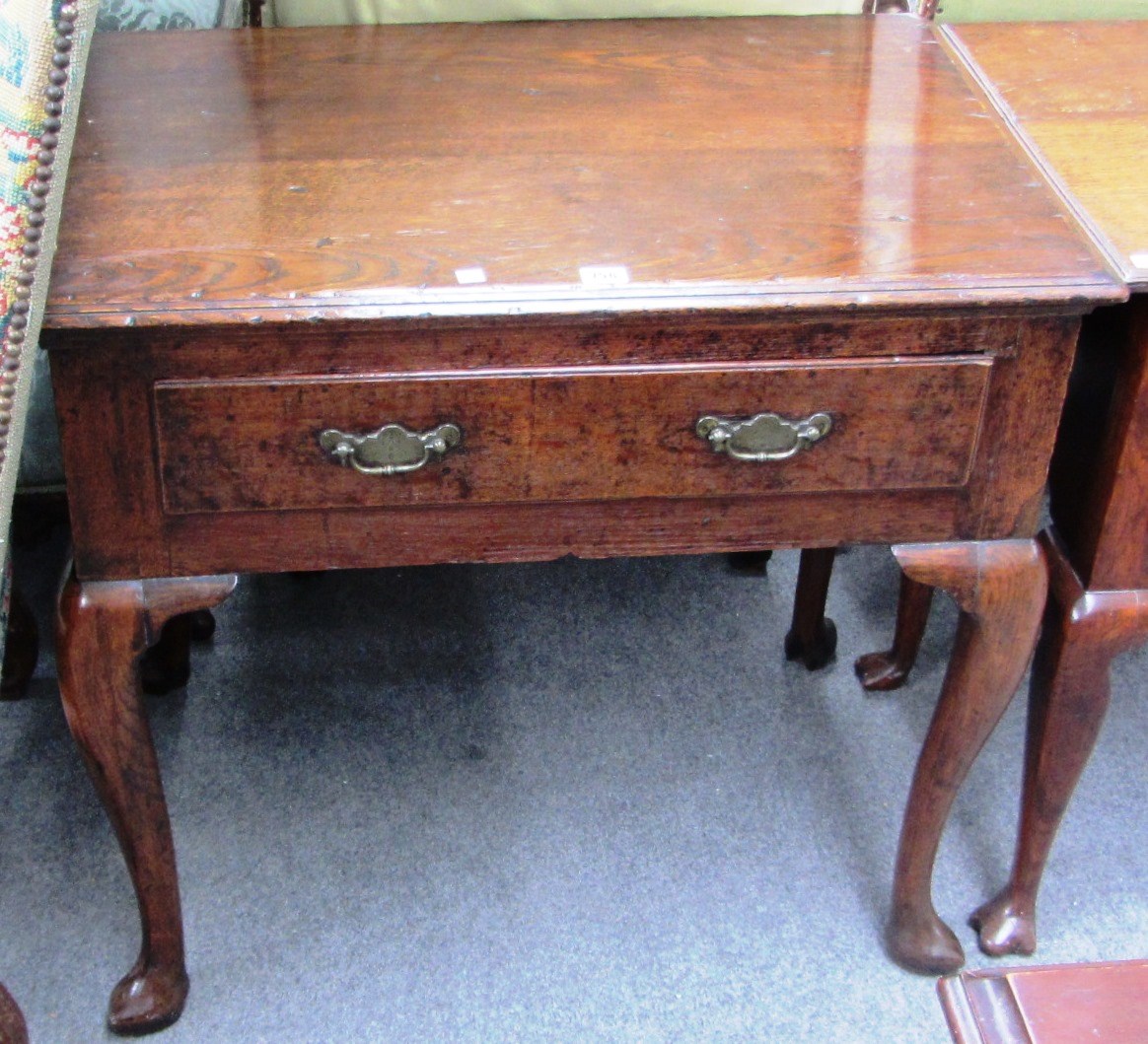 Appraisal: A mid th century oak side table with single frieze