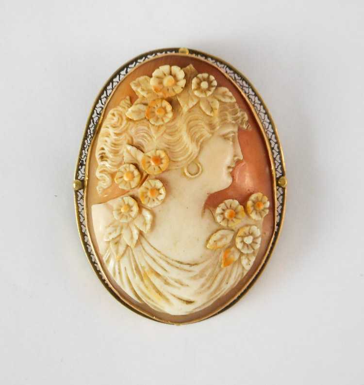 Appraisal: PORTRAIT CAMEO PENDANT BROOCH featuring a hand carved shell cameo