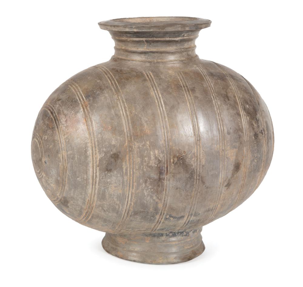 Appraisal: Chinese Han-Style Pottery Cocoon Vase melon-form with incised concentric bands