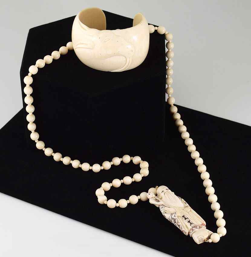 Appraisal: CARVED FIGURAL IVORY NECKLACE AND BRACELET To include Carved ivory