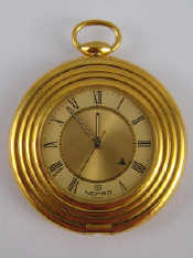 Appraisal: A Nepro Swiss travelling alarm clock purse watch mm wide