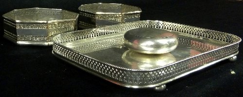 Appraisal: A pair of octagonal Sheffield plated wine coasters with pierced