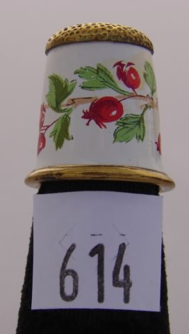 Appraisal: Porcelain thimble with red flowers and gilt cap and rim