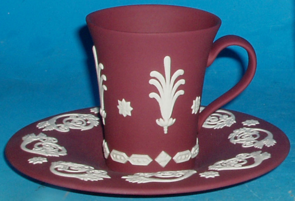 Appraisal: Wedgwood Crimson Jasper Coffee Can and Saucer