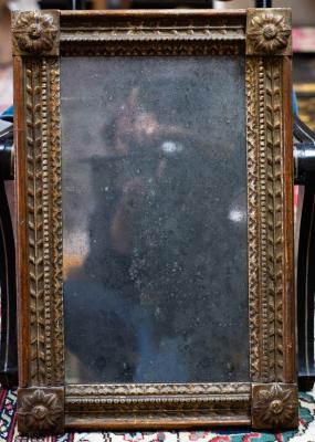 Appraisal: A gilt framed wall mirror with rosette motifs to the