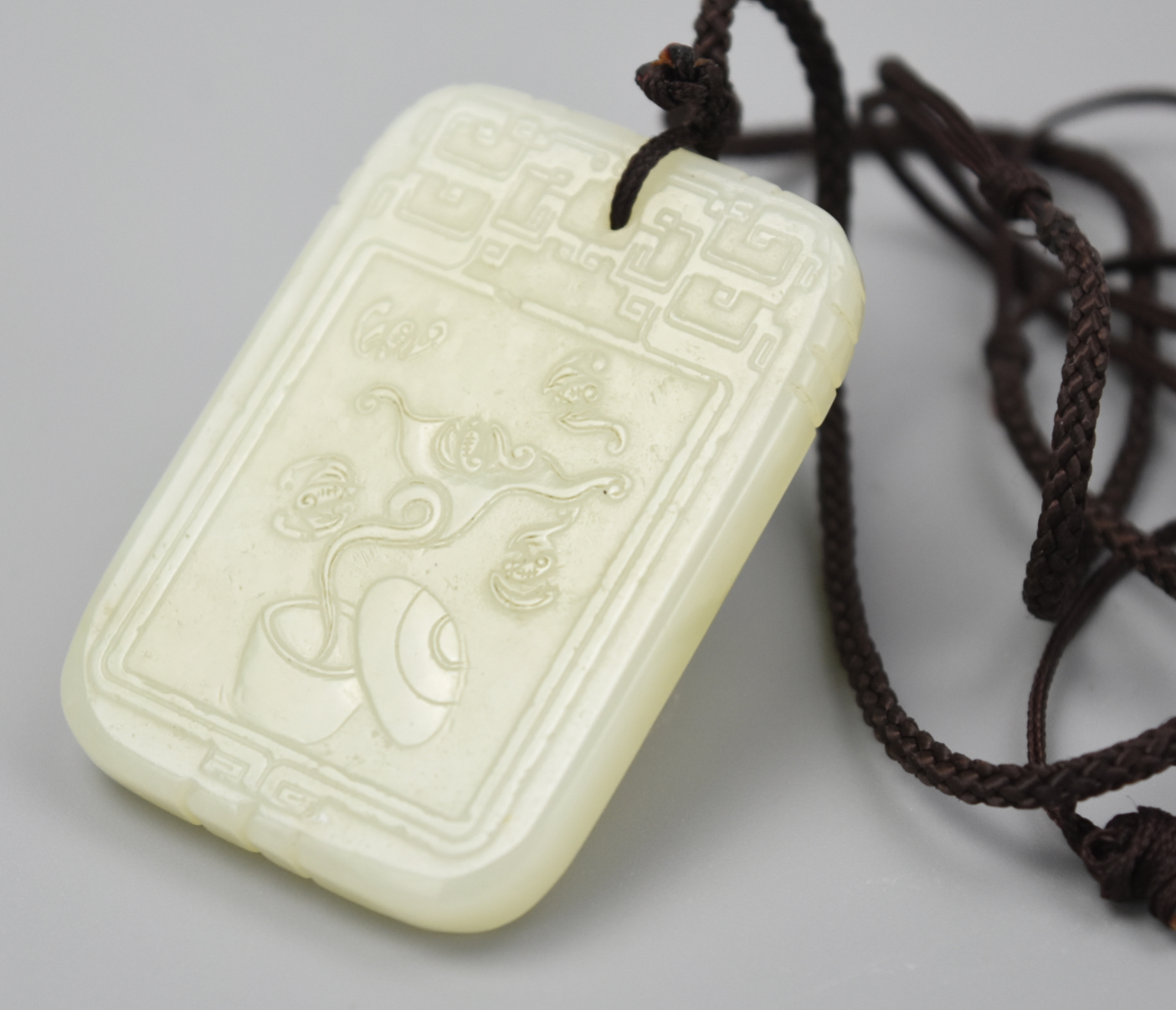 Appraisal: CHINESE JADE PENDANT W BATS QING DYNASTY a rectangular jade