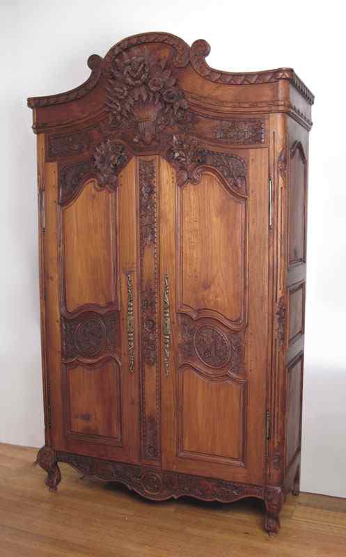 Appraisal: COUNTRY FRENCH CARVED ARMOIRE CABINET Illuminated interior fitted as for