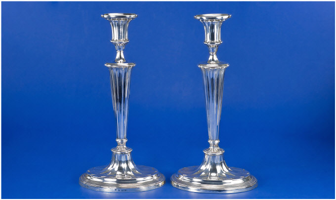 Appraisal: Pair of Edwardian Silver Fluted and Baluster Candlesticks With rounded