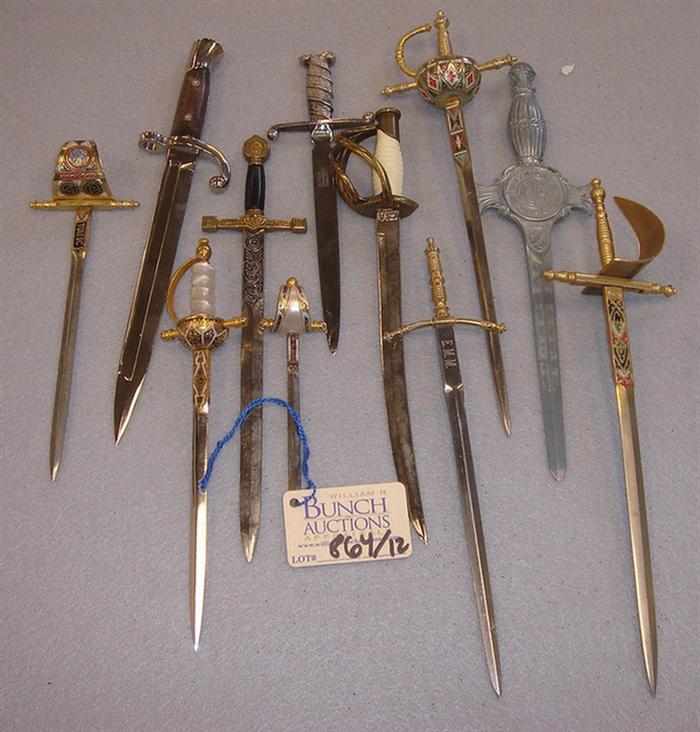 Appraisal: Lot of vintage sword shaped souvenir letter openers Including several