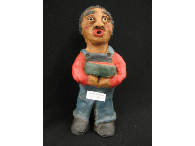 Appraisal: Folk Art Pottery Figurine of Man holding a watermelon