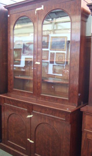 Appraisal: A mid Victorian plum pudding mahogany bookcase the plain stepped