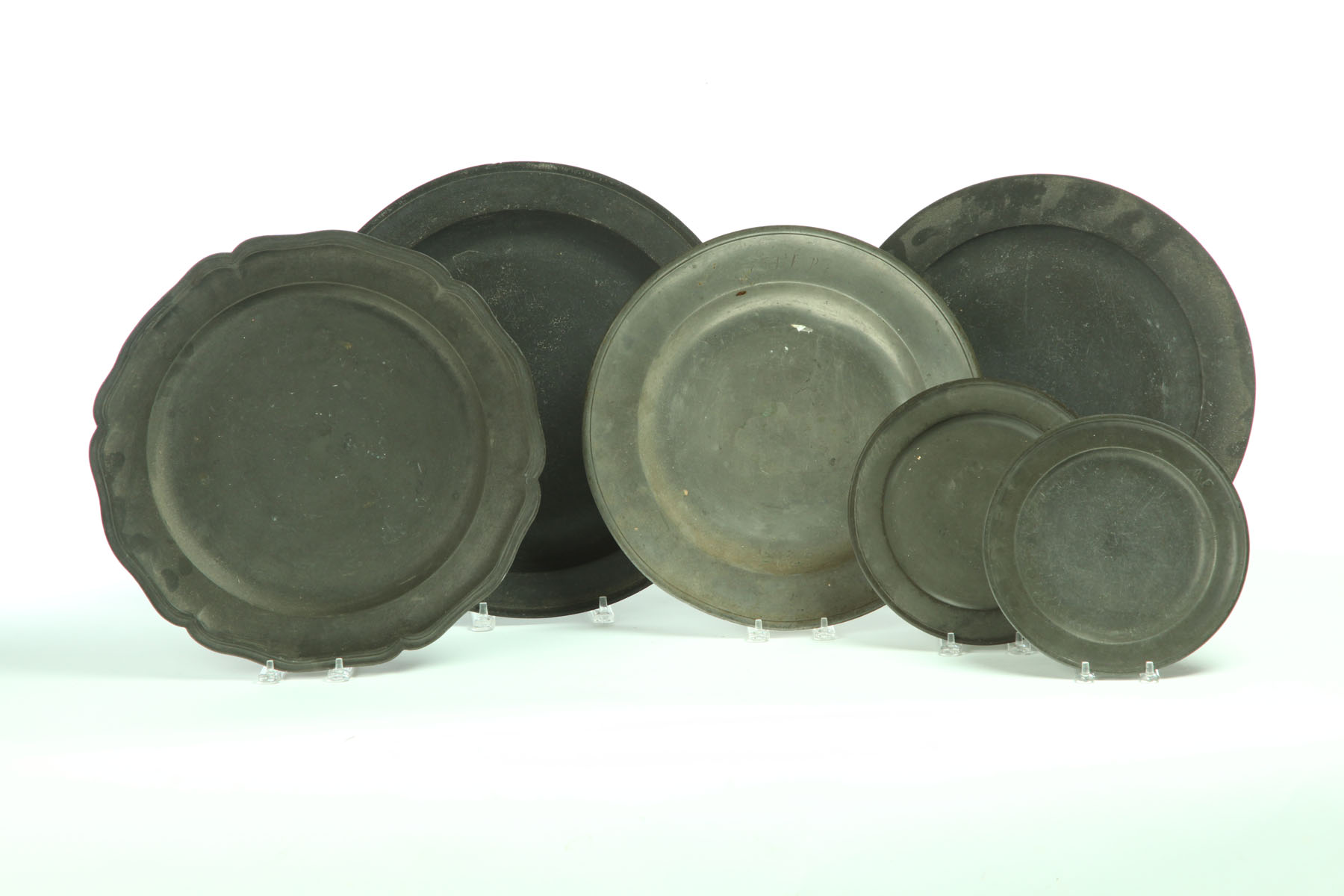 Appraisal: SIX PEWTER PLATES AND CHARGERS European th- th century Two