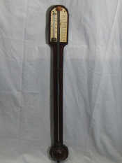 Appraisal: A rosewood stick barometer complete with thermometer the ivory scale