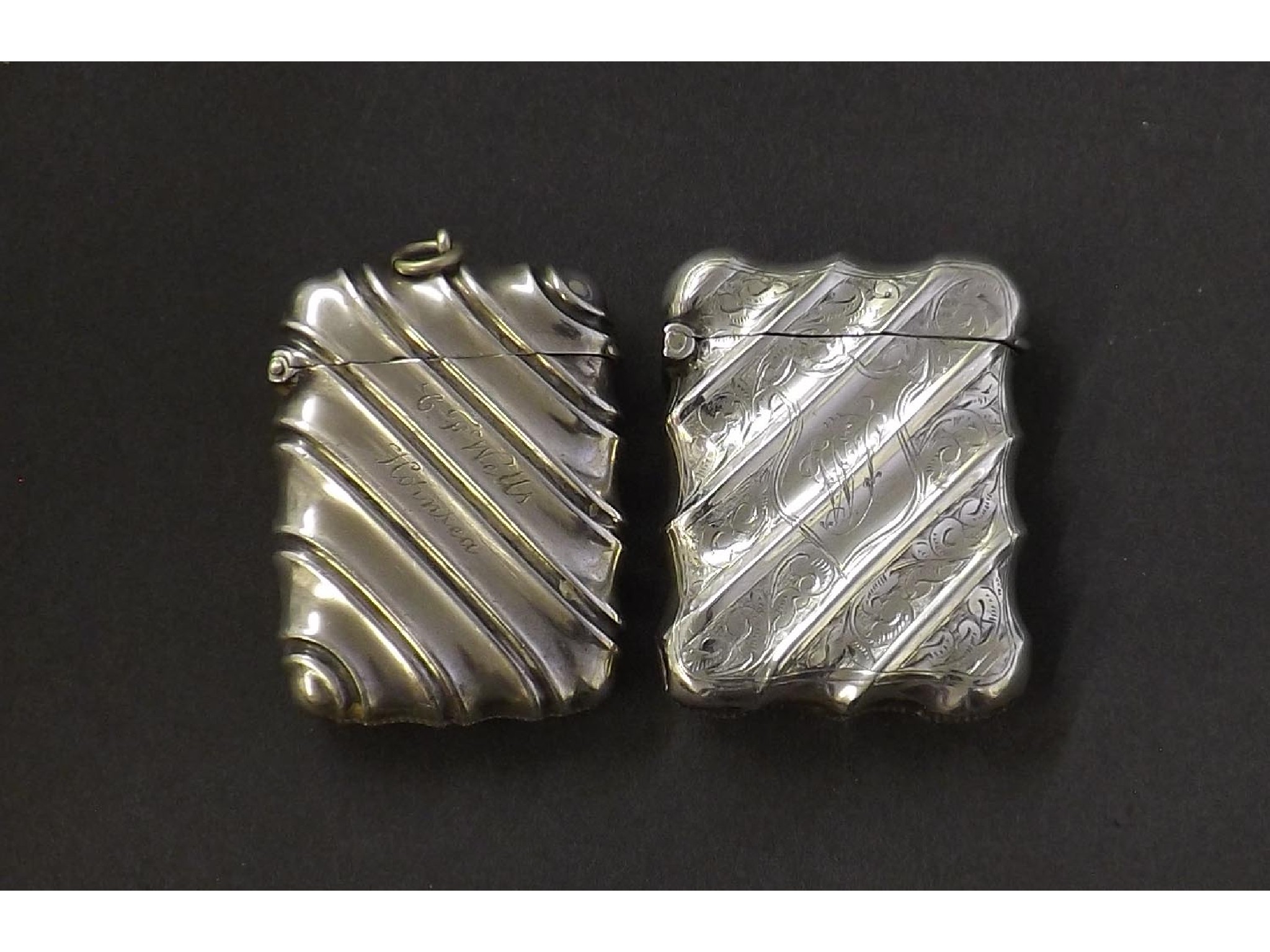 Appraisal: Two Victorian silver wrythen fluted faceted vesta cases oz approx