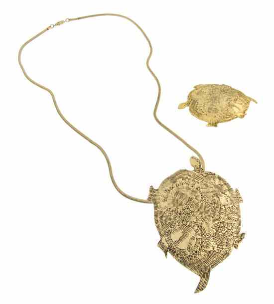 Appraisal: A Pauline Trigere Goldtone Turtle Pendant Necklace suspended from a