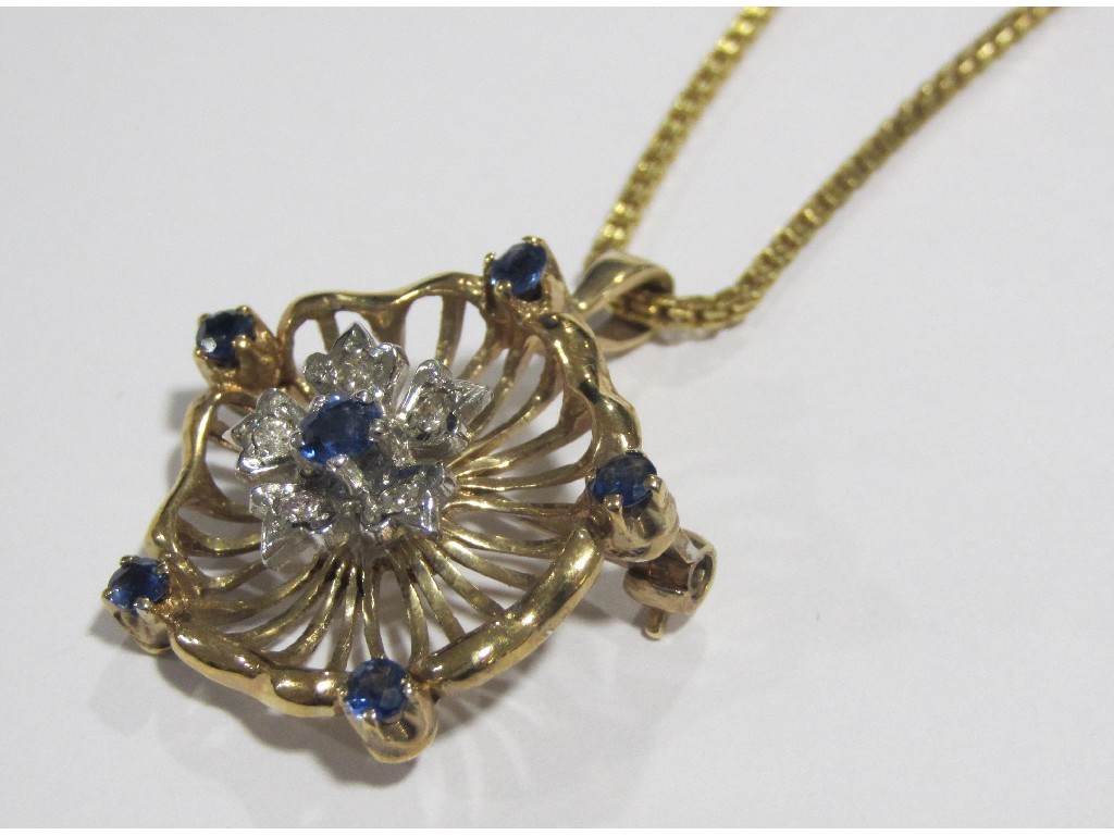 Appraisal: Nine carat gold sapphire and diamond set pendant brooch on