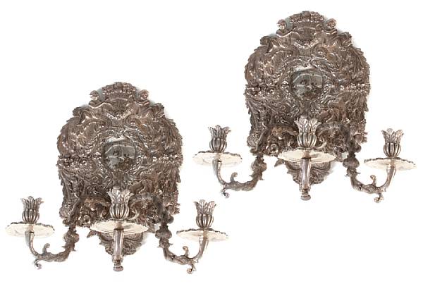 Appraisal: A pair of Spanish Rococo style three light wall sconces