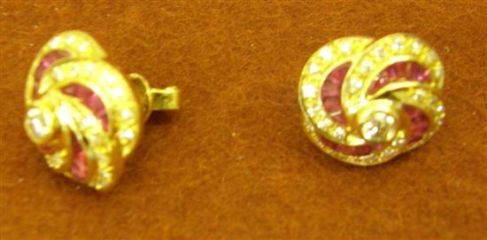 Appraisal: One pair of calibre set ruby and diamond whorl style