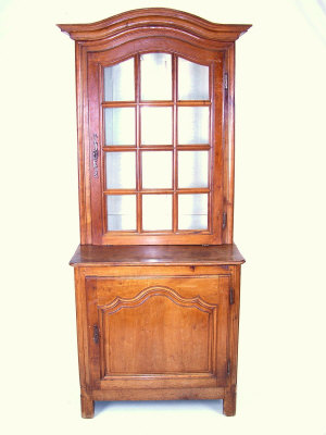 Appraisal: A French fruitwood cabinet th century the arched moulded cornice