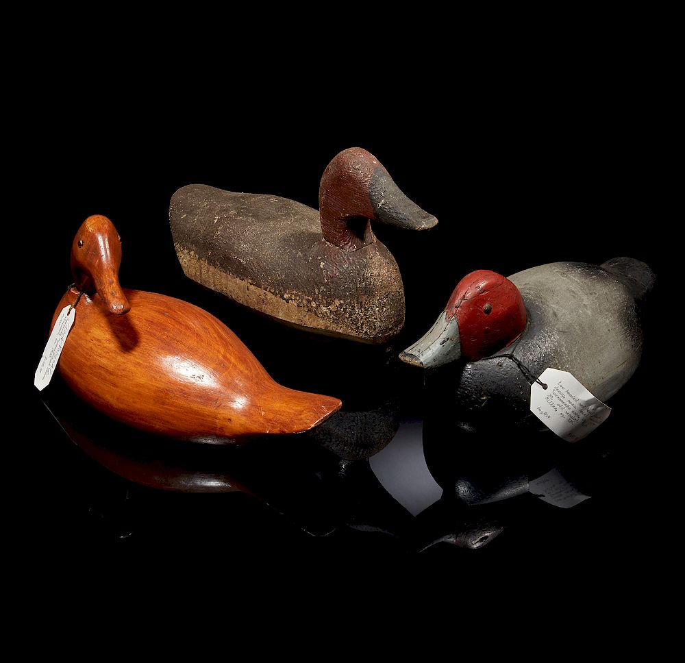 Appraisal: Three Duck Decoys Three duck decoys comprising a stripped wood