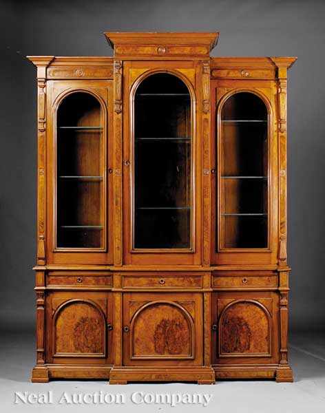 Appraisal: An American Renaissance Carved and Burl Walnut Breakfront Biblioth que