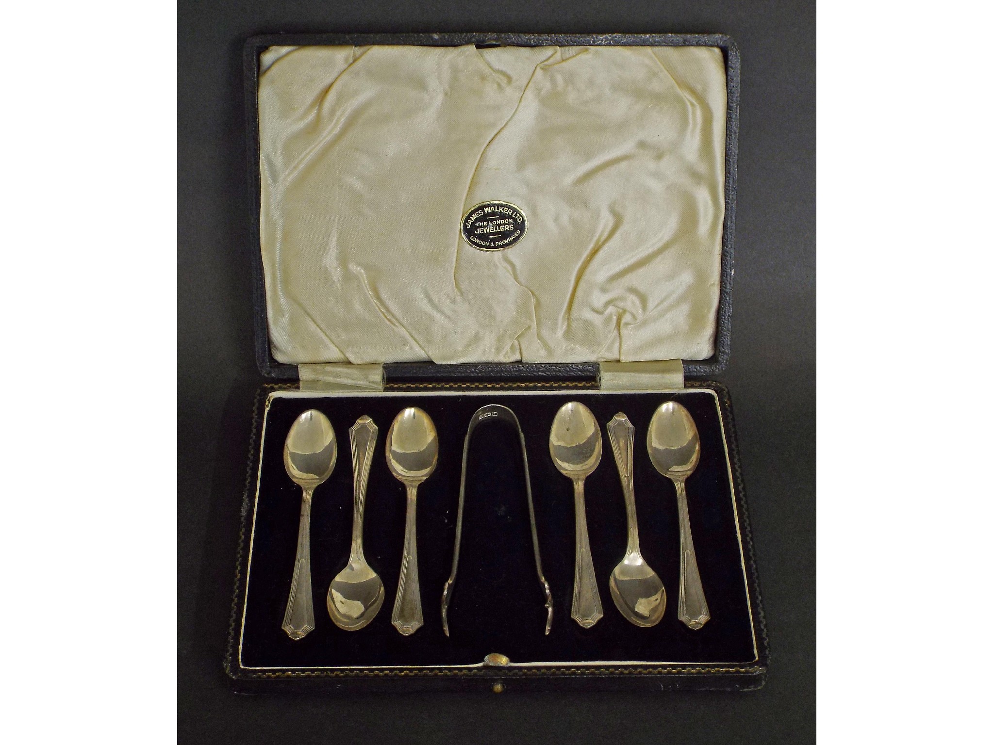 Appraisal: s silver suite of six teaspoons and sugar nips maker