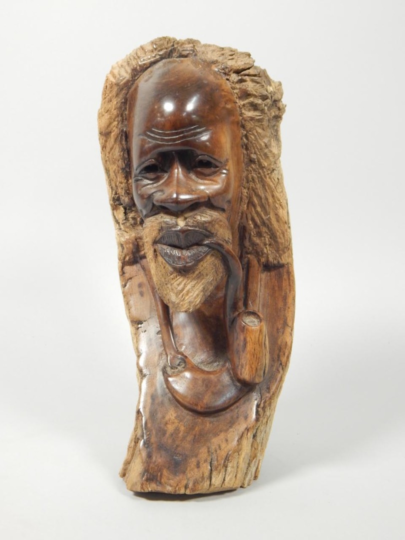 Appraisal: Tribal Art African carving in the form of an old