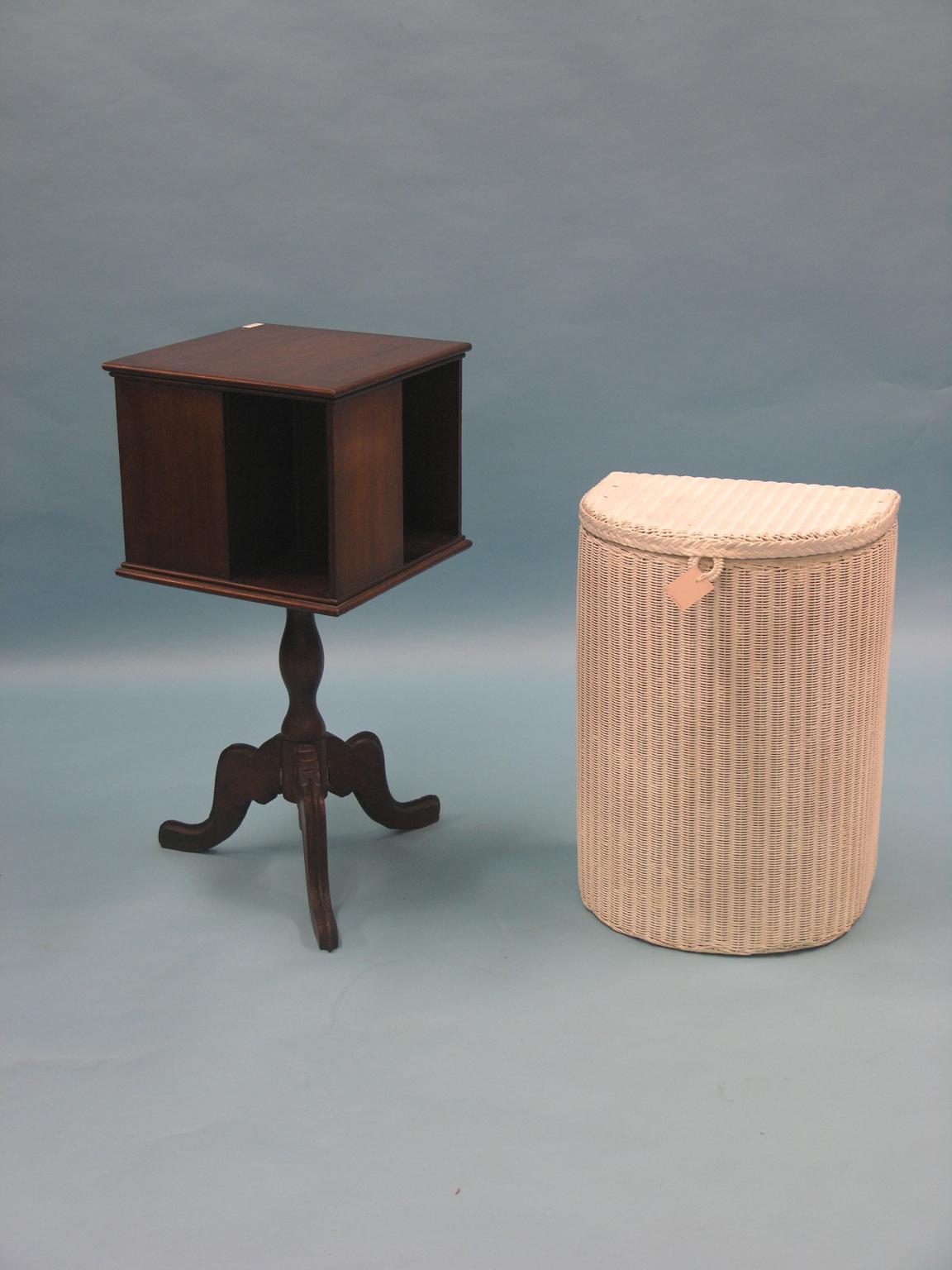 Appraisal: A mahogany revolving bookcase on tripod base and a cream-sprayed