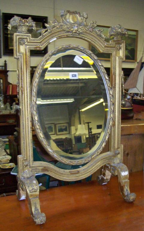 Appraisal: An Edwardian gilt dressing mirror in elaborate frame -