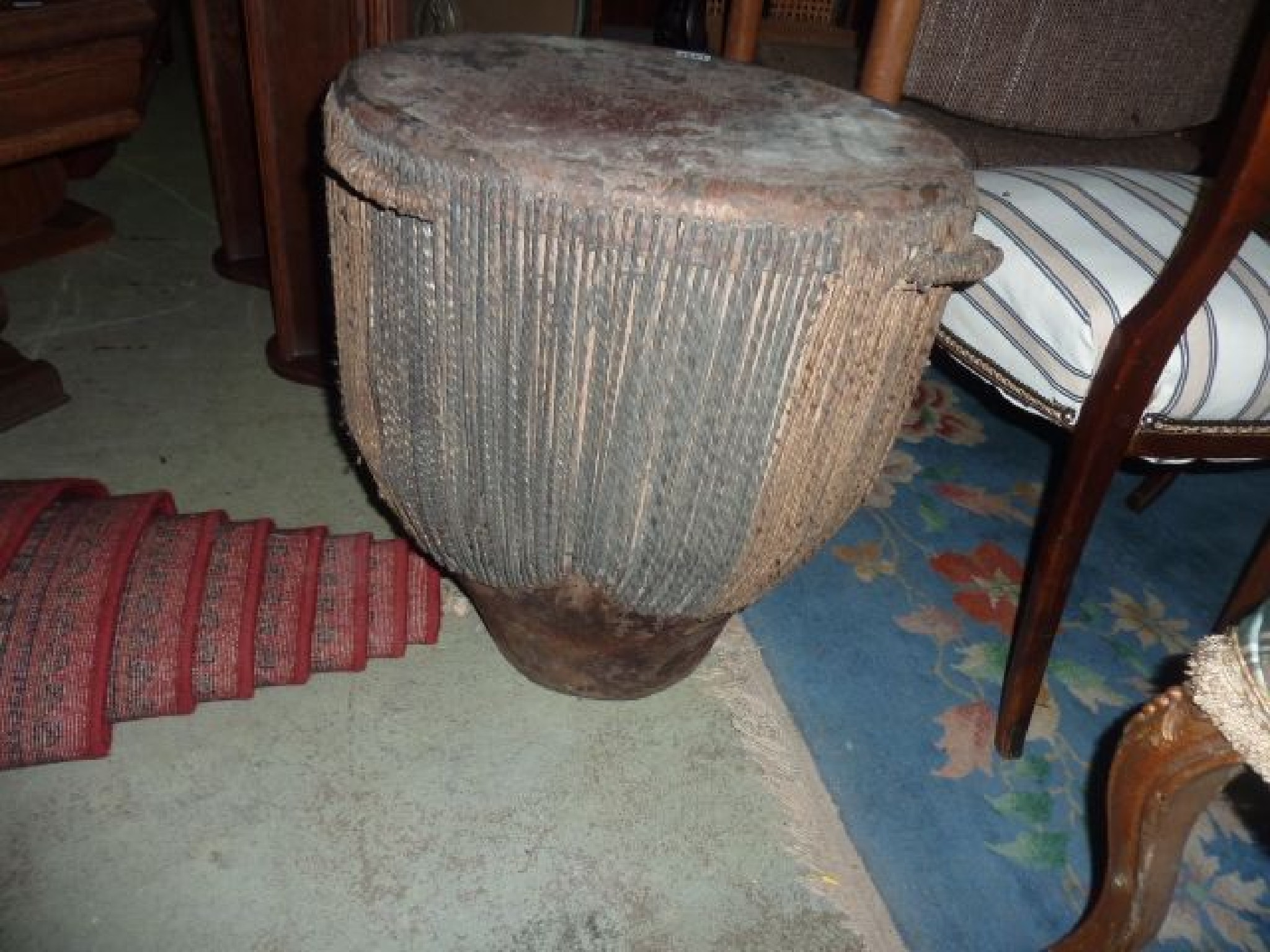 Appraisal: A tribal drum with skin covered finish