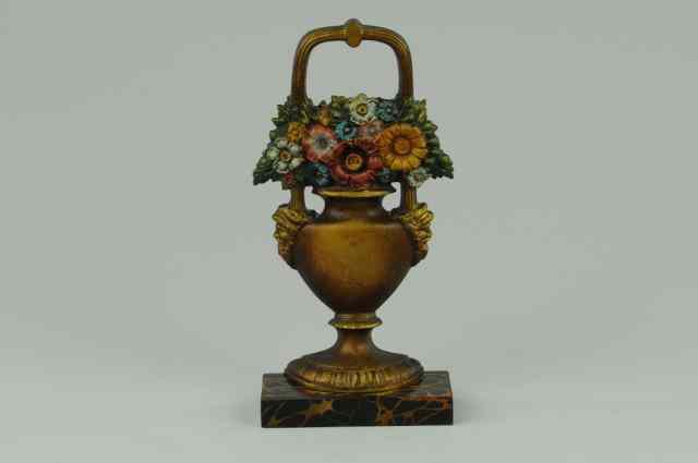 Appraisal: MIXED FLOWERS IN URN DOORSTOP B H cat -N fine