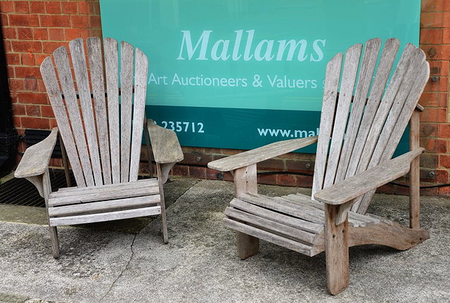 Appraisal: A PAIR OF ADIRONDACK TEAK GARDEN ARMCHAIRS