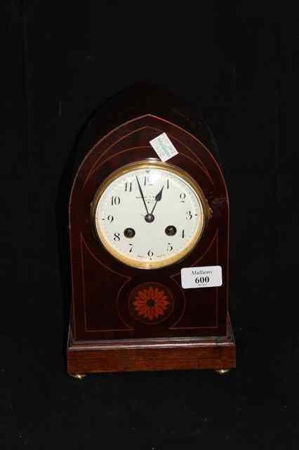 Appraisal: AN EDWARDIAN MAHOGANY CASED MANTEL CLOCK with Gothic arch pointed