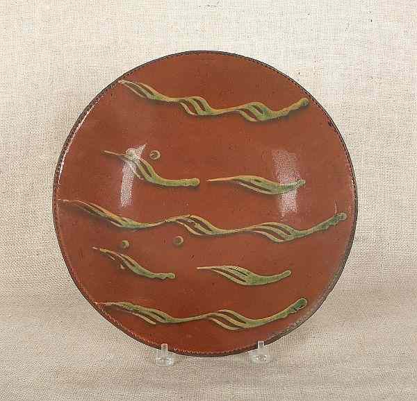 Appraisal: Connecticut redware charger th c with yellow and green slip