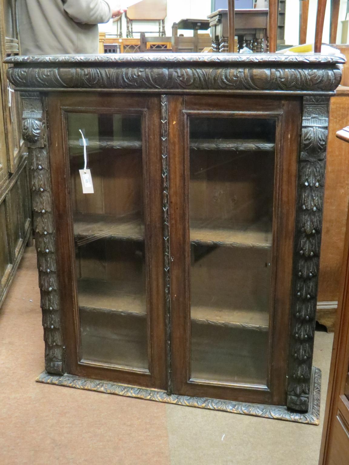 Appraisal: A late Victorian dark oak bookcase upper stage only three