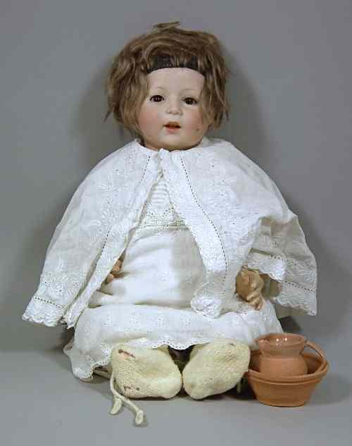 Appraisal: An Armand Marseille bisque headed doll with closing brown eyes